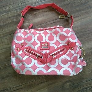 Melon colored Coach purse.
